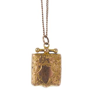 An early 20th century 9ct gold locket. Of square outline with shaped base, engraved with floral and
