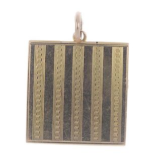 An early 20th century gold locket. Designed as a square with engine turned lines to the front and ba