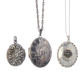 Three oval lockets. To include a 1970s silver locket with engraved foliate detail to the front and a