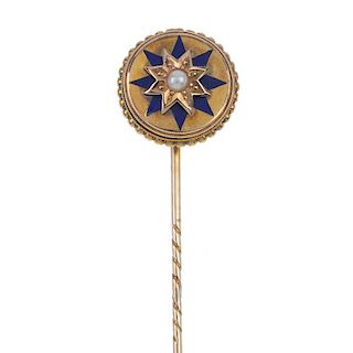 A late 19th century split pearl and enamel stickpin. The split pearl star, within a blue enamel star