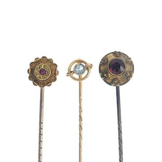 A selection of stickpins. To include one in the shape of a cross, together with another of circular