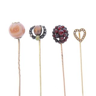 Four stickpins. To include a heart-shaped terminal set with seed pearls, a spherical banded agate te