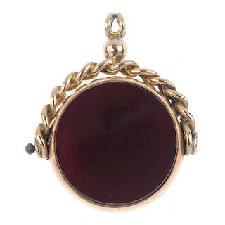 An early 20th century 9ct gold swivel fob. The circular fob with bloodstone to one side and carnelia