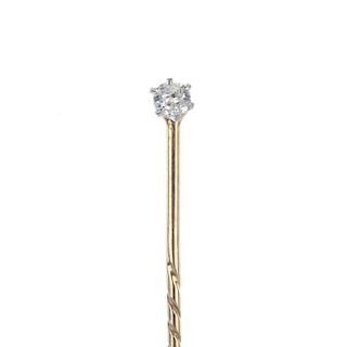 A stickpin with diamond stud. The brilliant-cut diamond with threaded mount, which can be screwed in