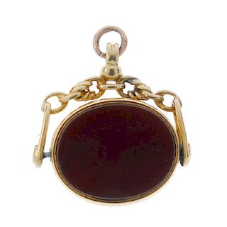 A late Victorian 18ct gold swivel fob. The oval carnelian and bloodstone swivel panel to the rope-li