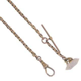 A late 19th century 9ct gold Albert chain. The chain-link chain to the scrolling station and fob wit