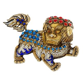 A Chinese enamel brooch. Designed as a Chinese guard lion or Foo dog, the filigree work body with bl