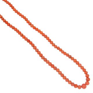 A coral necklace. Comprising a single row of spherical coral beads measuring 3 to 7mm, to the spring