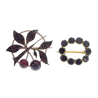 Two garnet brooches. The first designed as ten circular garnets set as an open oval-shape, the secon