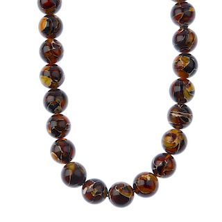 A bonded amber necklace. The thirty-five bonded amber spherical beads each measuring 1.2cms. Length