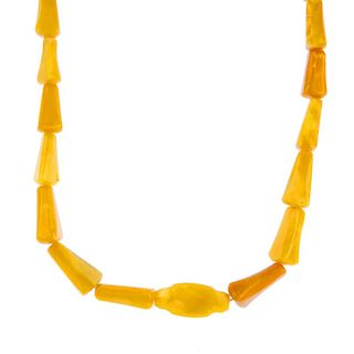 A natural amber necklace with reconstructed amber clasp. Designed as a series of tapered natural amb