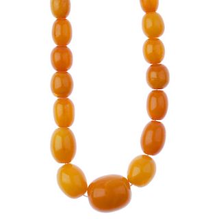 An amber necklace. Comprising eighty-four graduated oval-shape beads measuring 0.6 to 1.7cms. Length