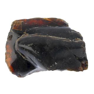 A piece of rough Indonesian amber. Polished to one side. Measuring approximately 5 by 9 by 13cms. We