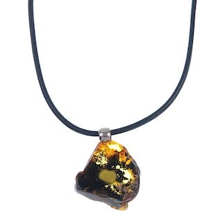 Three amber necklaces and four heart-shape amber pendants. One necklace designed as a leather cord t