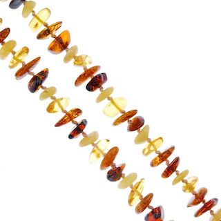 A selection of amber jewellery. To include a natural amber necklace, the freeform beads to the metal