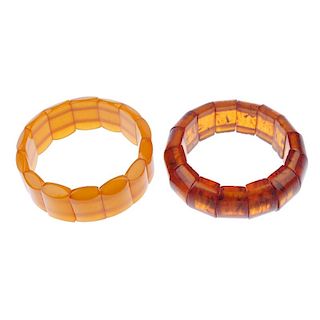 Two reconstructed amber elasticated bracelets. Each designed as a series of oval-shape reconstructed