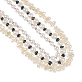 Three cultured pearl necklaces, two with gems. One comprising a series of irregular-shape cultured p