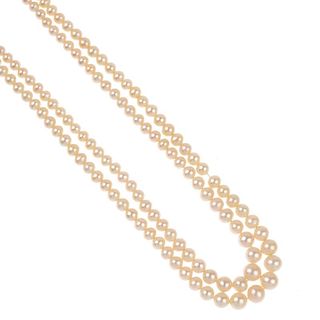 Three cultured pearl necklaces. To include a single-strand necklace and two two-row necklaces, cultu