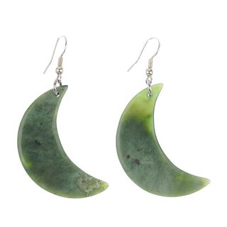 A pair of Maori jade ear pendants. Each shaped as a crescent moon, to the ear hook. Lengths 5.6 to 5