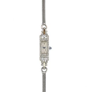 An early 20th century silver paste cocktail watch. The rectangular bezel set with colourless circula