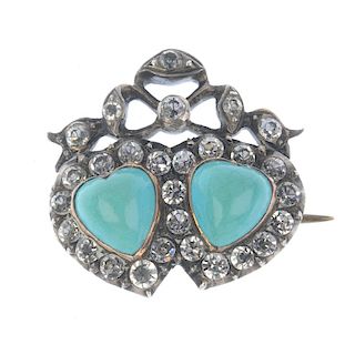 An early 20th century silver paste double heart brooch. Designed as two collet-set opaque blue paste
