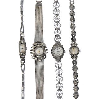 Four marcasite-set watches. To include an early 20th century silver watch with rectangular face and