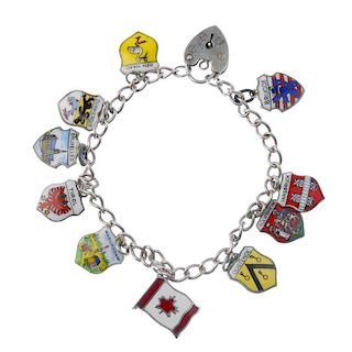 A selection of charm bracelets and loose charms. To include four curb-link charm bracelets, suspendi