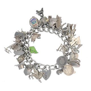 Three charm bracelets. Suspending a total of eighty-nine charms including a number of tourist enamel
