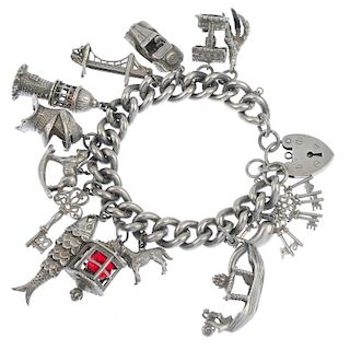 Two charm bracelets. The two curb-link bracelets suspending forty-seven charms to include a seagull