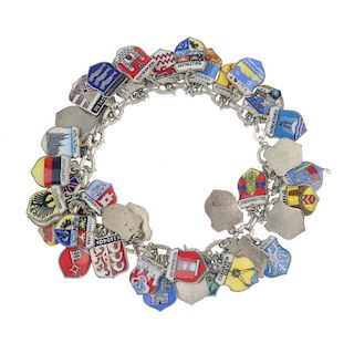 Five charm bracelets. To include three curb-chain, one fancy-link and one chain-link bracelet, suspe