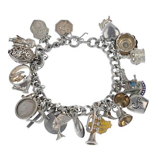 A selection of broken charm bracelets. The four broken bracelets suspending a total of forty charms,