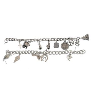 A selection of broken charm bracelets. The thirteen broken chain sections suspending a total of eigh
