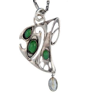 A paste set pendant. Designed as an abstract shape of curves and three collet-set green pastes and s