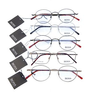 HUGO BOSS - five pairs of glasses. Four of the same design, differing in colour, featuring thin meta
