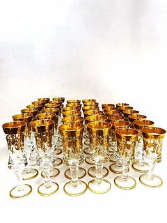 Collection of 36 french glasses with raised gilding.