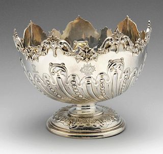 A late Victorian silver rose bowl, the circular form with wrythen fluted body interspersed with bead