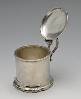 A Victorian silver mustard pot, the plain cylindrical form on fluted spread foot rising to the domed