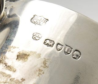 A Victorian silver christening mug, the plain tapered form with engraved crest and 'C' shaped handle