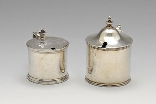 A late Victorian silver mustard pot of plain cylindrical form having beaded rims, a simple scroll ha