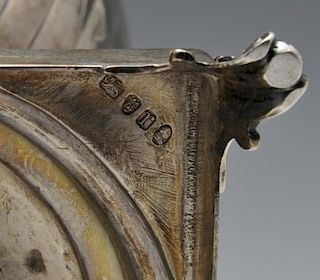 A George III silver tea urn, the crested urn form with twin hinged loop handles, part fluted body an