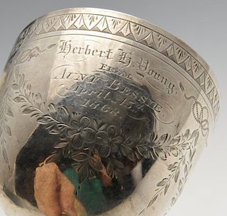 A Victorian silver goblet engraved with floral swags and presentation inscription. Hallmarked H J Li