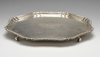 A 1930's silver salver of lobed octagonal outline, having gadrooned rim, a later central presentatio