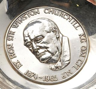 A 1960's silver dish in commemoration of Sir Winston Churchill, the circular form with shaped rim an