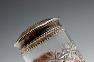 A 1920's silver and tortoiseshell lidded cut glass vanity jar. Hallmarked Herbert Scott Murdoch, Bir