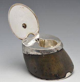 An early Victorian silver mounted hoof inkwell, the hinged lid engraved with floral motifs and scrol