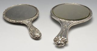 An Art Nouveau silver mounted hand mirror embossed with a stylised image of an angel, hallmarked Bir