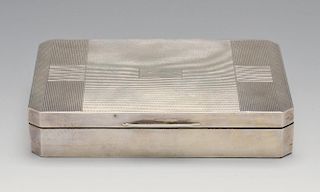 A 1940's silver mounted table cigarette box, of rectangular form with canted corners having engine-t