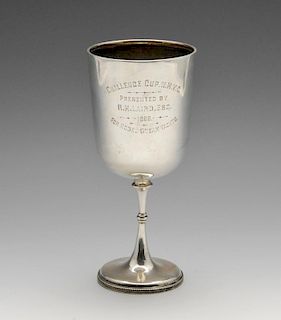 A Victorian silver presentation goblet, the plain form with inscription and standing on a knopped st