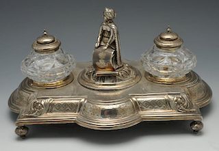 A mid-Victorian silver inkstand of shaped rectangular outline, decorated with a border of foliate mo