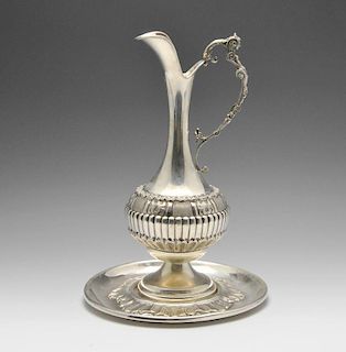 A mid-twentieth century Italian ewer on circular stand, the ewer of bulbous form decorated with lobe